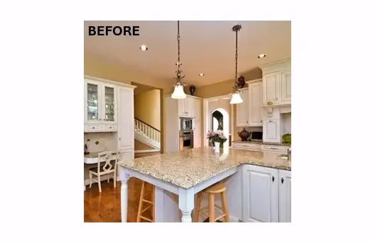 Traditional kitchen with white cabinets and island.